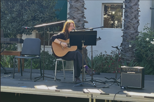 Founder of Song Share Gemma Wyles ('25) performs an original song. Song Share is an event that happens monthly to bi-monthly. The first song share of the year occurred on Nov. 8 in the courtyard.